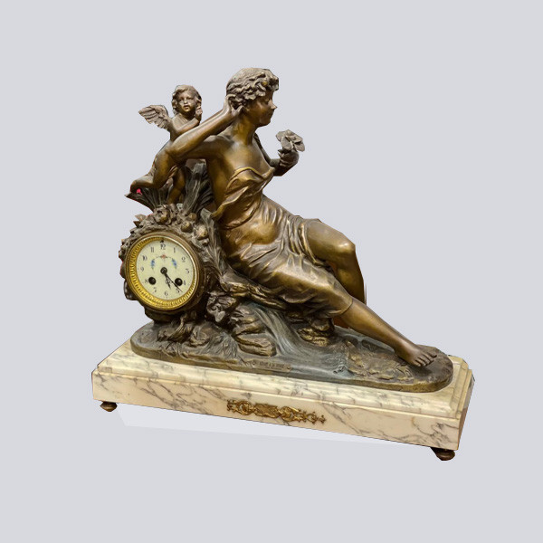 Collectible Bronze Table Clock with Marble Base Representing a Laying Lady with an Angel Behind Her