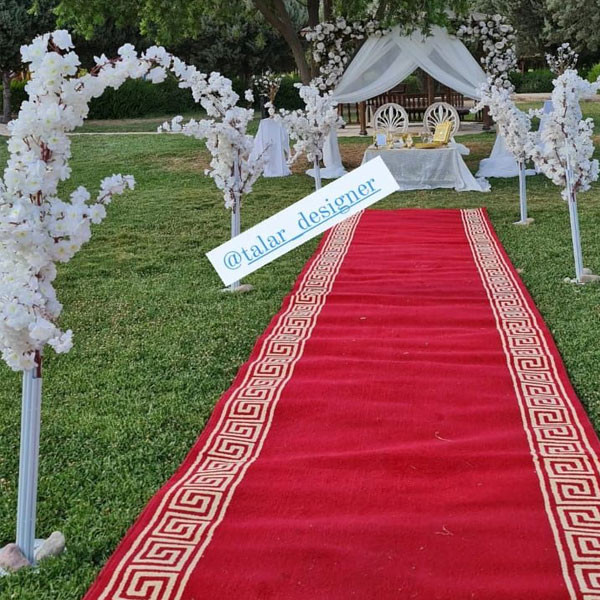 Wedding Decoration with Red Carpet, 2 Elegant Chairs, 4 Metallic Stands & 1 Round Gate Stand Decorated with Flowers & Sheet, 1 Big Table, Golden Metallic Quran Book, etc..