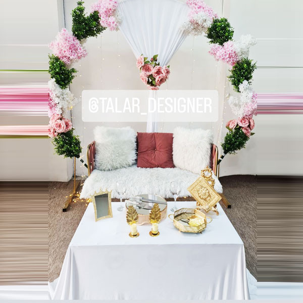 White Shade Wedding Decoration with Big Table, Couch with Fiery Pillows & Seat, Gate Round Metallic Stand Decorated with Flowers & Sheet, Golden Metallic Quran Book, etc..